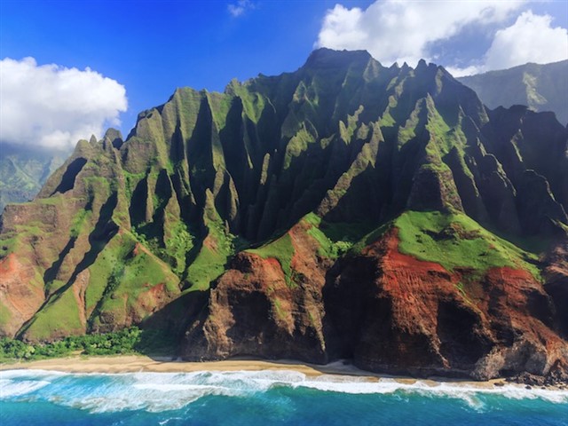 On the island of Kauai, also known as the Garden Isle, you can explore the famed Na Pali Coast. Along the coast, sheer cliffs covered in lush, green v...