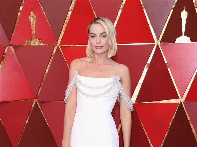 in Chanel Haute Couture.