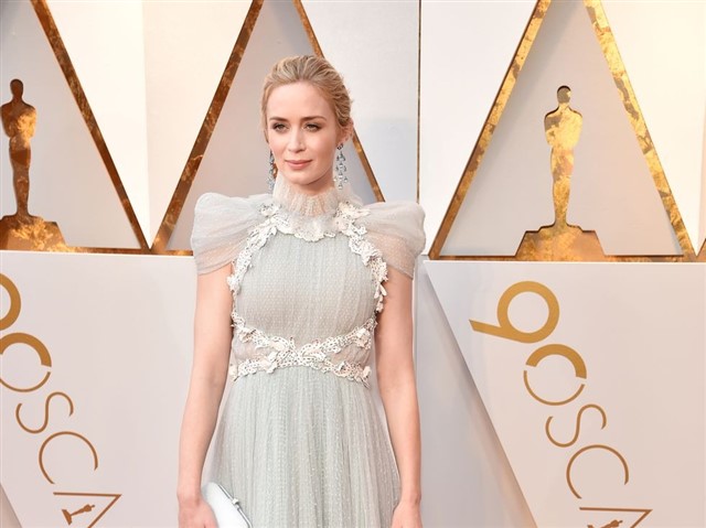 in Schiaparelli Haute Couture.