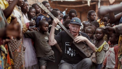 Lazarus Lazarus is a short documentary following Lazarus Chigwandali, a street musician with Albinism from Malawi as he teams up with a London-based music pro...